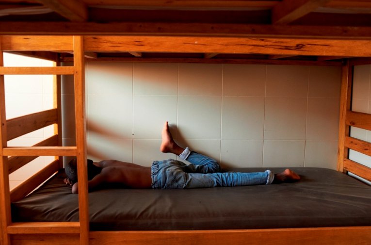 A boy sleeps during the afternoon siesta at the Samu Social shelter in Dakar.
