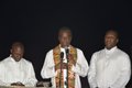 Priests offering prayers for Komla