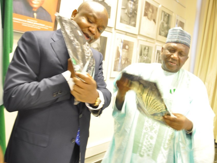 Chairman of the Governing Board of the National Lottery Regulatory Commission - Damian. D. Dodo, SAN presents a gift to Dr Dalhatu Tafida