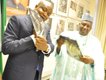 Chairman of the Governing Board of the National Lottery Regulatory Commission - Damian. D. Dodo, SAN presents a gift to Dr Dalhatu Tafida