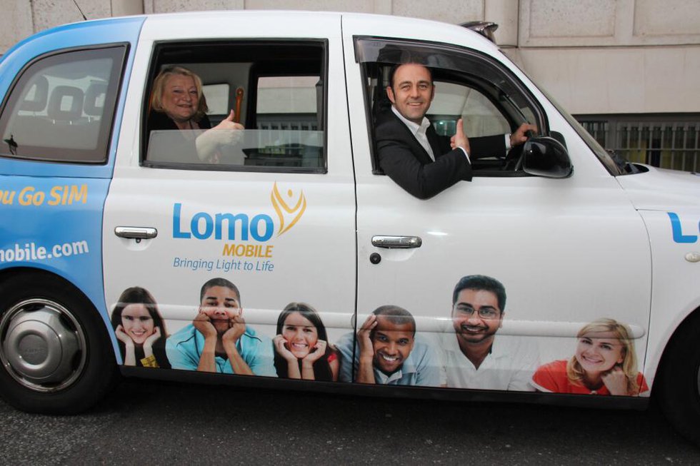 Lomo's Kim Delve and Paul Schonewald in one of the Lomo Cabs being used for the marketing campaign