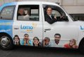 Lomo's Kim Delve and Paul Schonewald in one of the Lomo Cabs being used for the marketing campaign