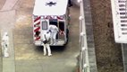 Dr. Kent Brantly, right, gets out of an ambulance after arriving at Emory University Hospital in Atlanta.jpg