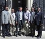 A delegation of APC UK pose in front of 10 Downing Street
