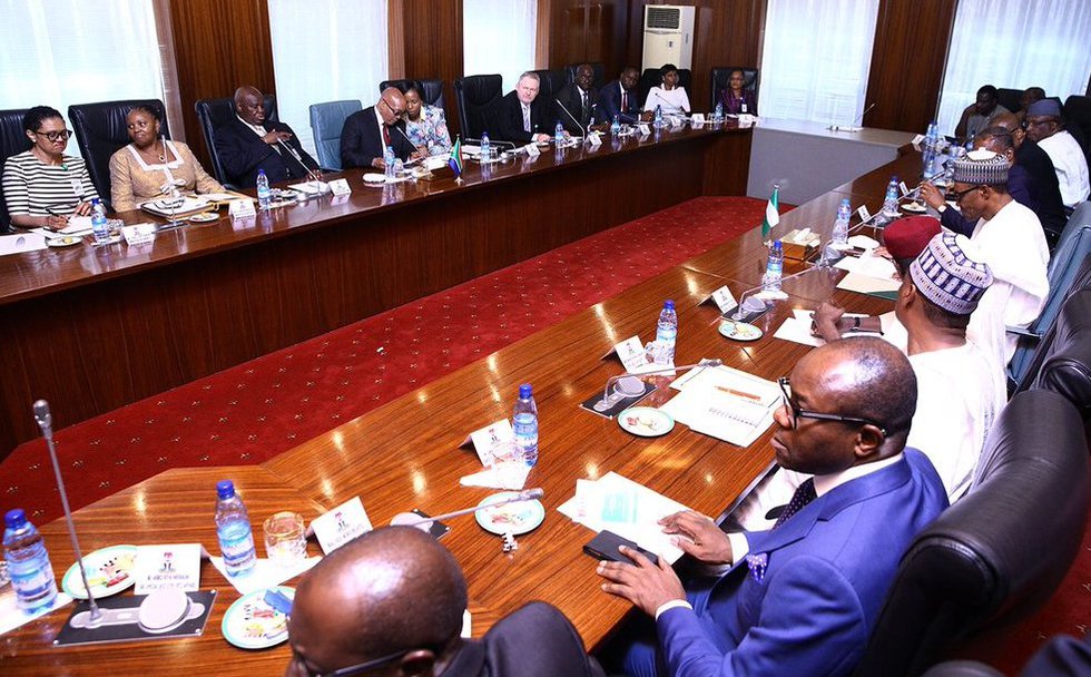 The South Africa and Nigeria sides in talks at the State House.jpg