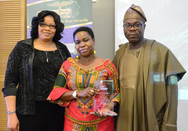 Wambui Njau (centre) was presented her GAB Award by Mr &amp; Mrs Paul Olubunmi of PK Sales and Lettings at GAB Awards 2015