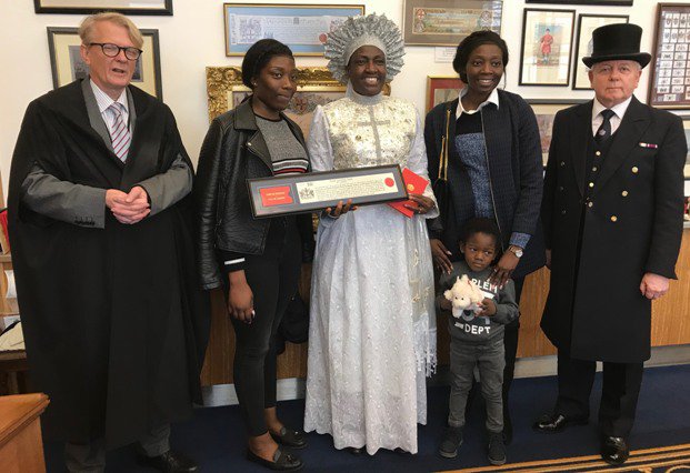 Rev Ajayi and her children - Ola and Simi and grandchild - Malachi flanked by Clerk of the Chamberlain&#x27;s Court and the Beadle