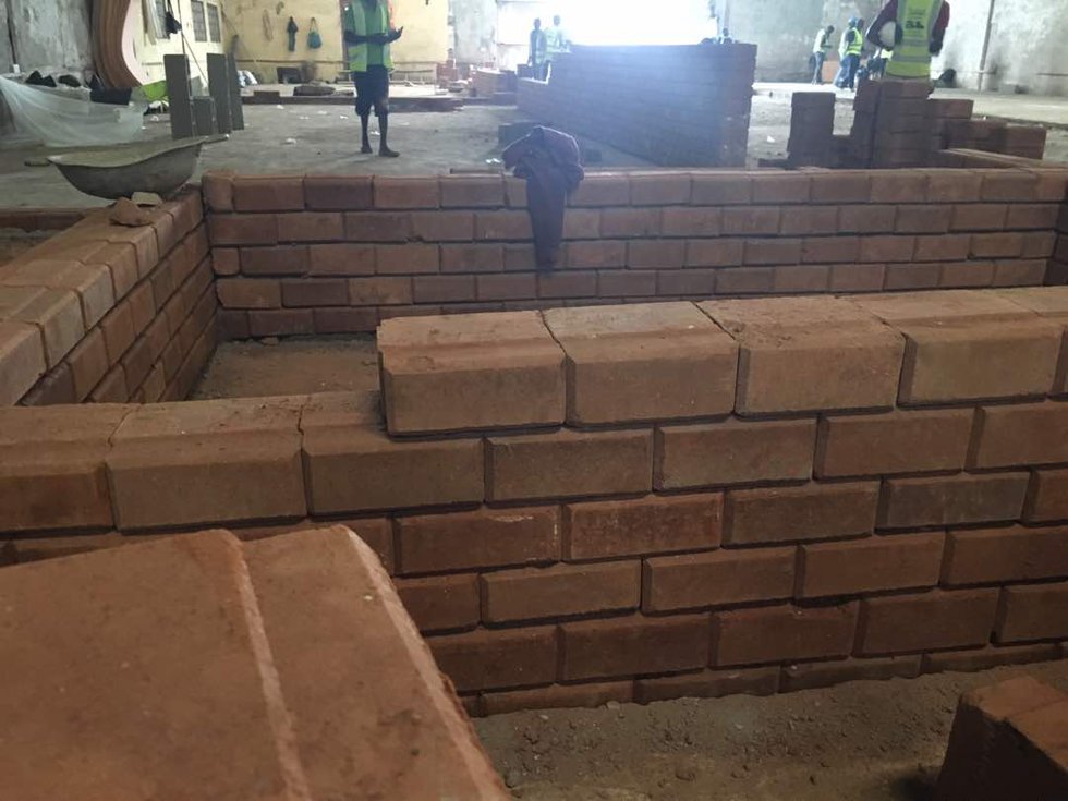 A site under construction with laterite bricks