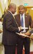 Amosun in a quick chat with his Deputy Chief of Staff.jpg