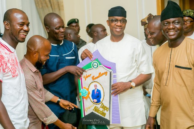 Journalists present a Congratulatory card to Abiodun.jpg