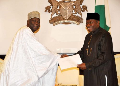 Cameroon's Vice Prime Minister - Ahmadou Ali (left) in a warm handshake with Nigeria's President Goodluck Jonathan (right)