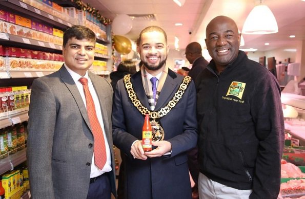 Mayor of Haringey - Cllr Adam Jogee flanked by Franchise owner Naz (left) and Tropical Sun's Head of Community - Paul Harrison