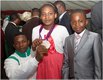 Anthony Ulonnam  silver medalist in the 56kg mens category with 2 young Nigerians.jpg