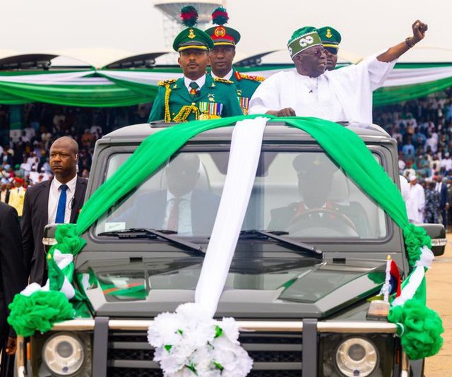 President Bola Ahmed Tinubu waving to Nigerians at Eagle Square