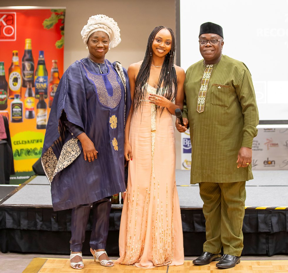 An Award recipient flanked by Mr &amp; Mrs Femi Okutubo