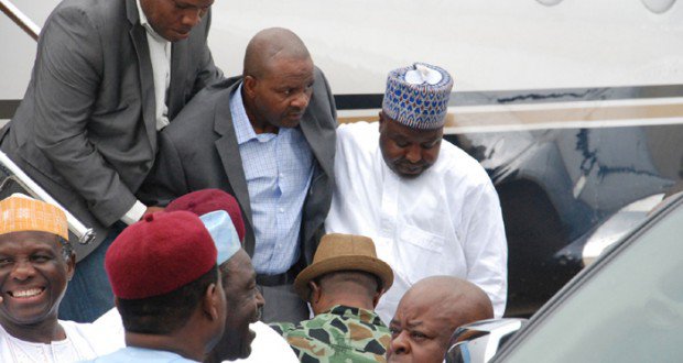 Suntai being helped into a car on arrival at Abuja on Sunday