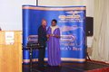 Ayan DeFirst receiving the award from the Mayor of Enfield - Cllr Kate Anolue.JPG
