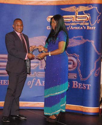 Fatima Jabbe presenting GAB Award to Club 87 s Dr Henry Okosun.JPG