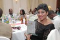 Producer of 'LABO - Life Is A Journey' - Roseline Sanni-Ajose shwos off the award won by the film